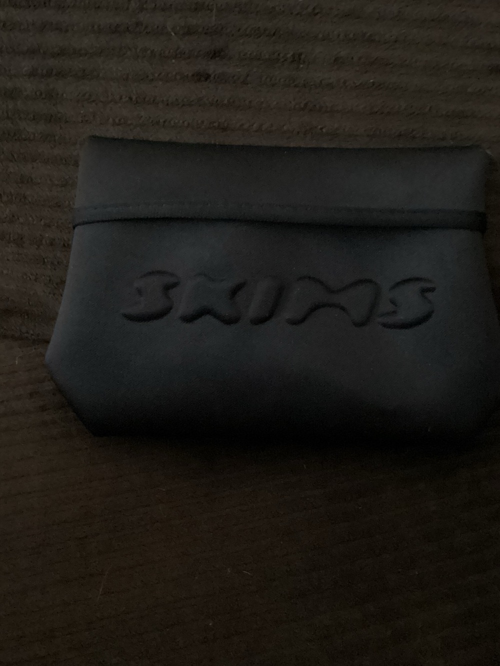 SKIMS Black Neoprene Toiletry Pouch with Embossed Logo